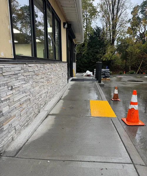 Sidewalk and curb gutter repair in Shell Gas Station in Newcastle 